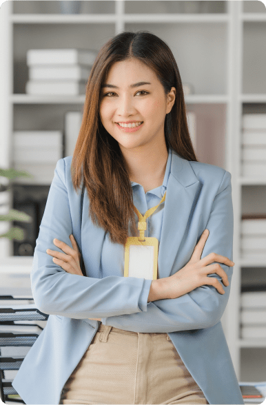 woman in a blazer with her arms crossed