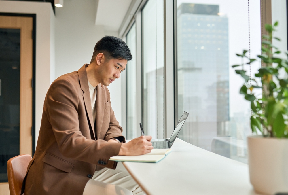 Young,Busy,Asian,Business,Man,Manager,Working,On,Laptop,In